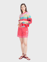 Colorful pink bomber jacket by IVKO Woman, featuring a fun jacquard pattern of geometric shapes, ideal for a playful summer look.