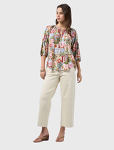 Printed blouse with V neckline, self-tie collar, blouson sleeves, and contrast sleeve tabs from Loobie's Story's Ceylon collection.
