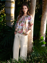 Bone multi printed blouse with V neckline, self-tie collar, and blouson sleeves, inspired by Sri Lanka's Ceylon collection.