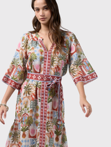 Stylish knee-length dress with floaty sleeves, contrast placket, waist tie, and decorative border print at sleeves and neckline.