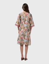Elegant knee-length dress featuring floaty sleeves, a contrast front placket, waist tie, and tucks for added volume at the neckline.