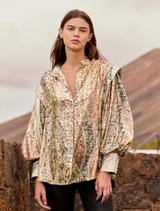 Multicolor lurex jacquard shirt with balloon sleeves, tulle lining, and a metallic sheen, ideal for evening wear.