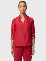 Dahlia Red Jardin Blouse, highlighting a breathable cotton-silk composition, embroidered features, and a casual silhouette.