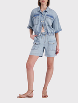 Stylish light denim shorts crafted from 100% lyocell, with an elastic waistband and both side and flap pockets for convenience.