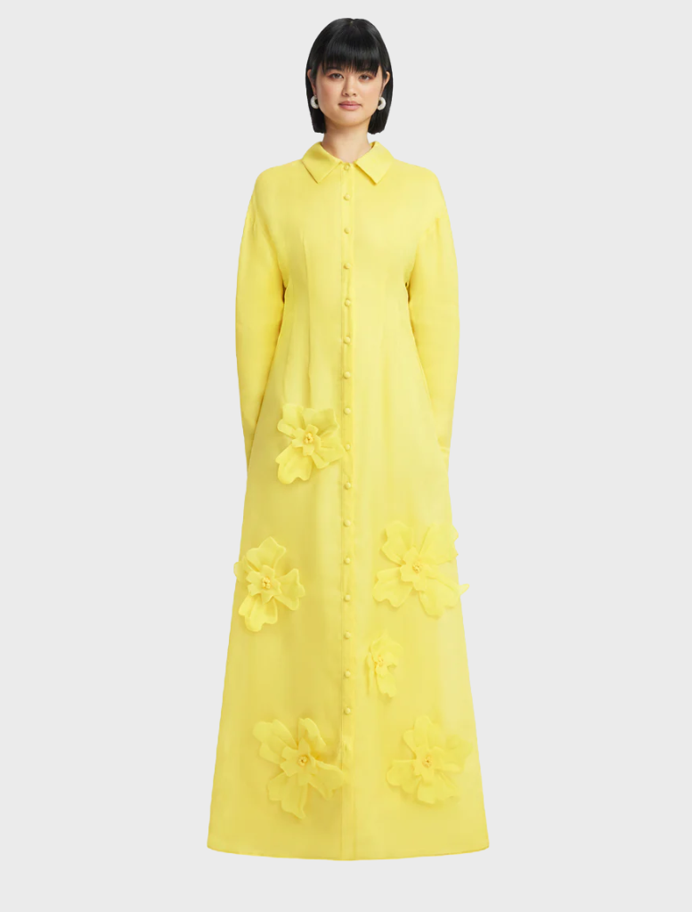 The image features a yellow dress crafted from soft, lightweight fabric, perfect for warm weather.