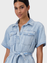Light blue denim shirt dress with a shirt collar, made from lyocell fabric, featuring a casual and stylish design.
