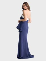 The Jefferson dress in navy and white stripes, presented on a hanger, highlighting its fashionable design and fabric.