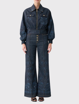 High-waisted denim flares with custom hardware and hand embroidery, designed for comfort and style in the Elsewhere Palace collection.