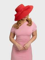 Red polypropylene Jess Droop Hat with a 12.5cm brim and a large bow trim, blending vintage aesthetics with modern flair.
