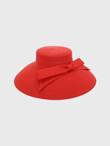 Jess Droop Hat in red, featuring a large bow trim, made from polypropylene, combining vintage style with contemporary design.