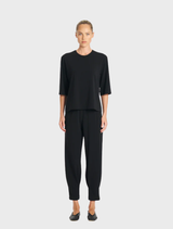 A pair of black jet pants, featuring a tailored fit and smooth fabric, ideal for versatile styling options.