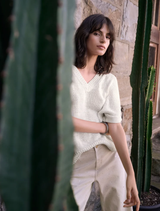 Lightweight knit v-neck sweater for women, designed as a comfortable tunic.