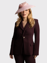 Classic pink fascinator with bow accents, sheer brim, and a headband for easy styling and comfort during wear.
