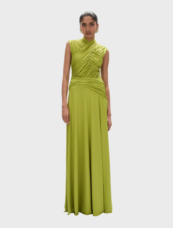  Elegant Juniper gown in apple green, featuring a flowing silhouette and delicate fabric for a sophisticated look.