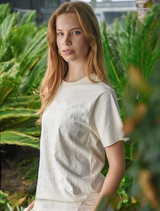 Standard fit cream t-shirt featuring a lace front overlay, combining comfort with a refined, feminine style.