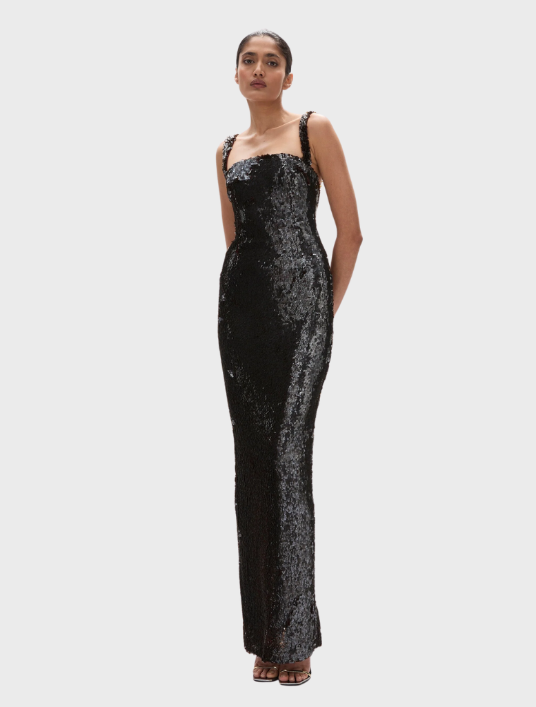 Elegant chocolate-colored Kaia gown with a flowing silhouette and delicate detailing, perfect for formal occasions.