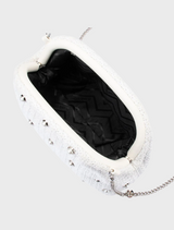 A sleek white clutch bag with silver studs, combining sophistication and contemporary style.