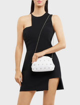 A fashionable white clutch bag embellished with silver studs, ideal for evening events.