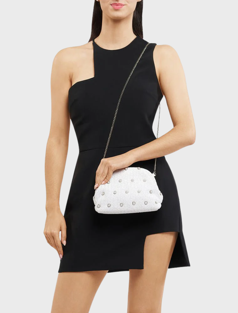 A fashionable white clutch bag embellished with silver studs, ideal for evening events.