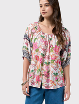 Silk white multi blouse with button front, decorative sleeve print, and elastic neckline for comfort and style enhancement.