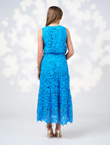 The model wears a Baja Blue lace dress with a belt, highlighting the elegant design of the Keira Skirt.
