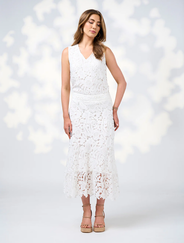 A soft, lightweight silk white lace dress, featuring delicate patterns and a flowing silhouette.
