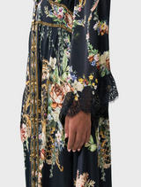Kimono-sleeve dress featuring shirring detail, showcasing a blend of elegance and contemporary design.