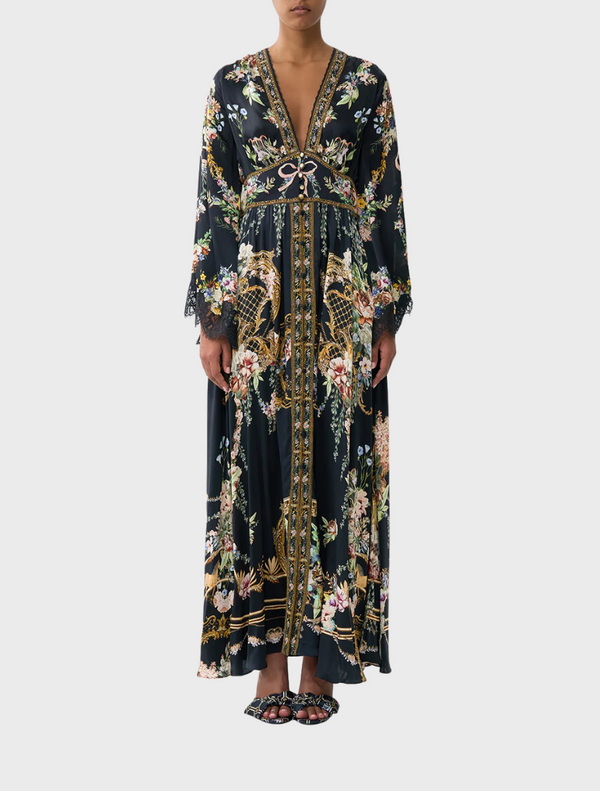 Kimono-sleeve dress featuring shirring detail, showcasing a blend of elegance and contemporary design.