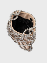 A chic bag crafted from metallic fabric, featuring a fashionable chain strap for easy carrying.
