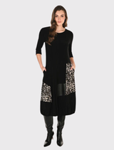 A-line midi dress in camel and black with animal print, round neck, 3/4 sleeves, and pockets for casual or semi-formal wear.