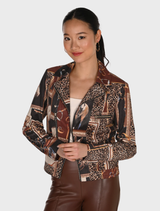 A woman models a dark brown and black knit jacket featuring an animal print design.