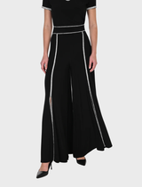 Black knit pants displayed on a white background, showcasing their soft texture and casual style.