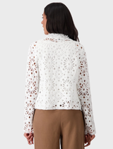 Cream lapel knitted blazer on a hanger, featuring a sophisticated design suitable for formal occasions.