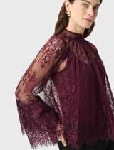 Elderberry lace trapeze top with soft gathers, keyhole back, and flounce cuffs, combining elegance with light movement.