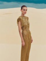 Luxurious gold Lani gown showcasing a sophisticated style and delicate accents, suitable for evening wear.