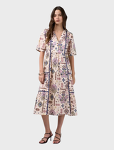 Bone multi printed dress with flattering gathered tiers, flat center front, contrast piping, and elasticated back waist.