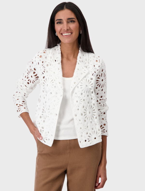  Cream lapel knitted blazer displayed on a hanger, showcasing its elegant design and soft texture.