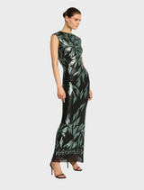 A model wears a vibrant black and green dress, illustrating a unique and trendy fashion statement.