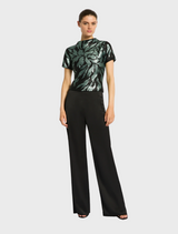 Model showcases the Larissa Top in Mint Black, paired with stylish wide-leg pants.