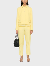 Yellow layered effect jacket with front button fastening, split cuffs, two flap pockets, and long sleeves.