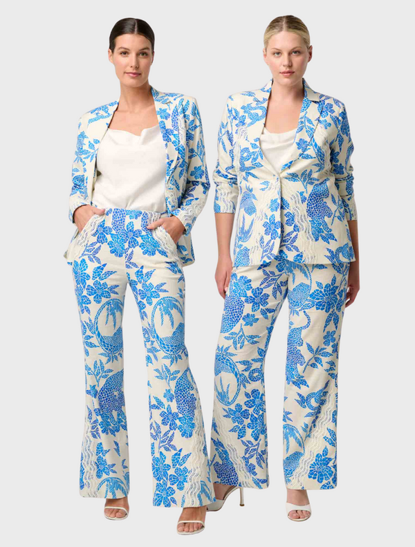 Two women in blue and white floral print pantsuits, showcasing the Leandro Contrast Lace Linen Viscose Stretch Pant design.