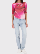 Comfortable pink T-shirt with a vibrant floral design, perfect for warm-weather days and versatile styling options.