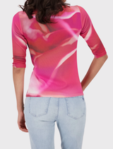 Spring-themed pink T-shirt by Leglet, featuring a vibrant floral pattern, ideal for layering or solo wear.