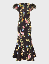 A puff sleeve maxi dress featuring a lemon vine print on an ebony background, showcasing elegant floral embellishments.