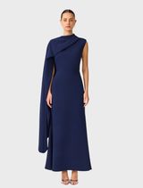 Deep navy Leonara asymmetric cape dress, featuring a flowing silhouette and elegant design for formal occasions.