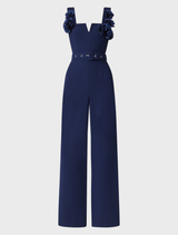 Leonara's sleeveless jumpsuit in deep navy, highlighting a contemporary design with a fitted top and wide-leg bottom.