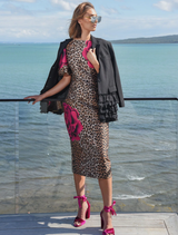 Elegant leopard floral dress featuring structured sleeves, fitted design, and a back hem split for comfort and style.