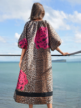 Elegant leopard floral dress with voluminous puff sleeves, keyhole neckline, and side pockets for a stylish yet practical look.
