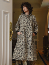 Leopard print coat titled "Ice To Meet You," designed for warmth and style, perfect for winter outings.