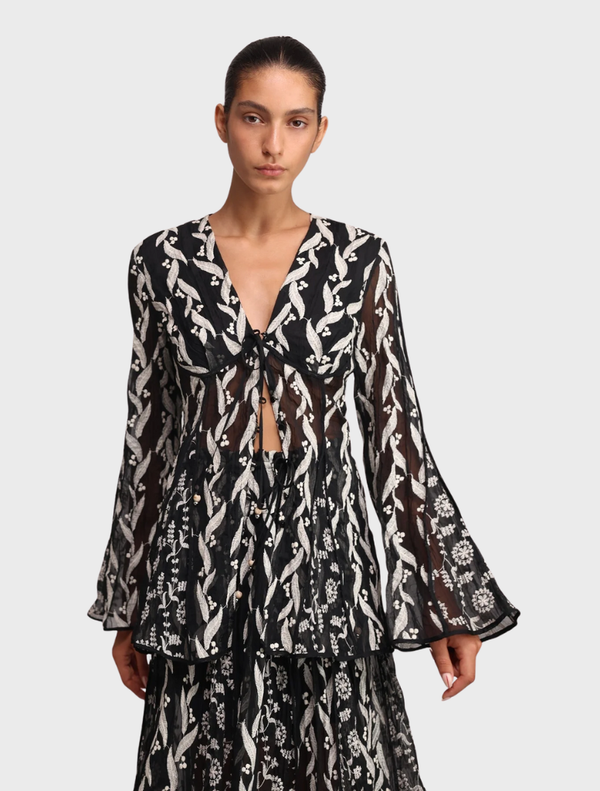 Black Lianne top featuring a sleek design, perfect for casual or formal occasions.